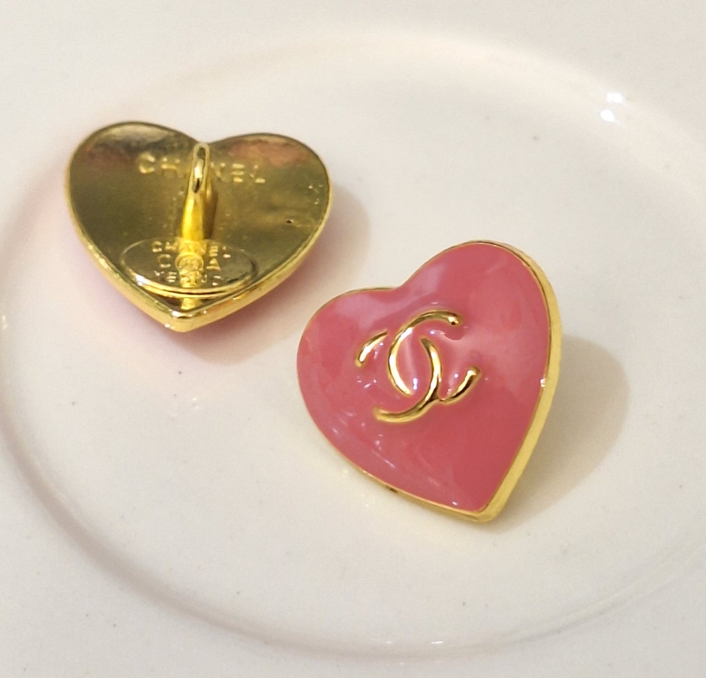 Buttons stamped. Gold & pink. 16 mm