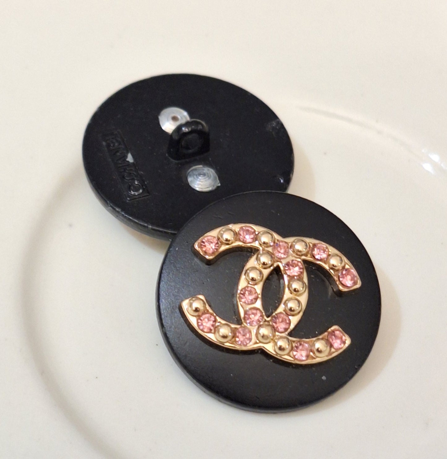 Buttons 1 pieces. Black, Gold, pink zircon. Stamped. 22 mm