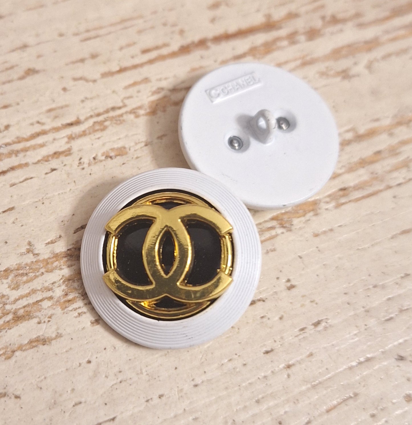 Buttons stamped, white, Gold & black. 24 mm