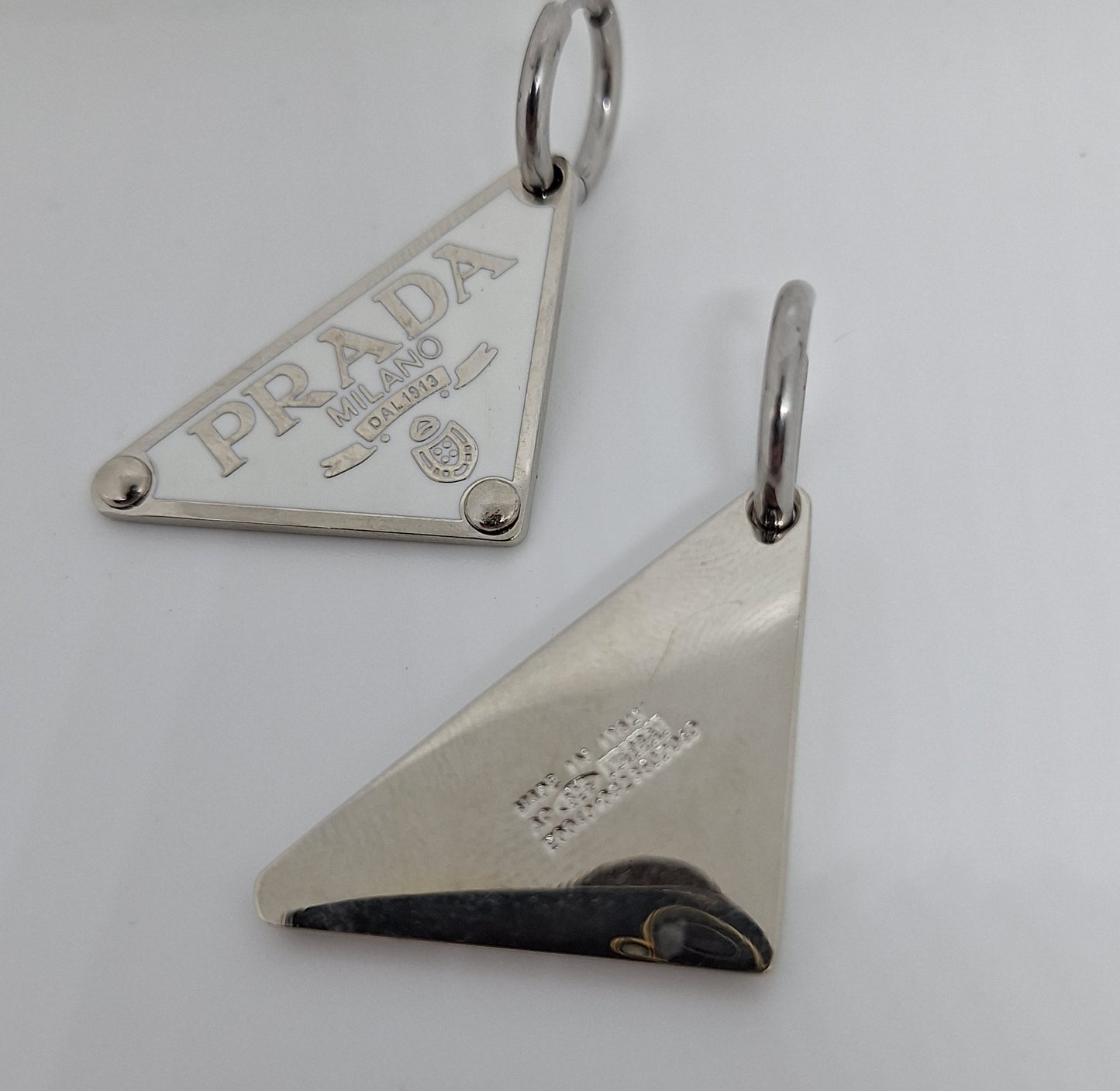 Earings  silver color  and white enemal.  56/24 mm