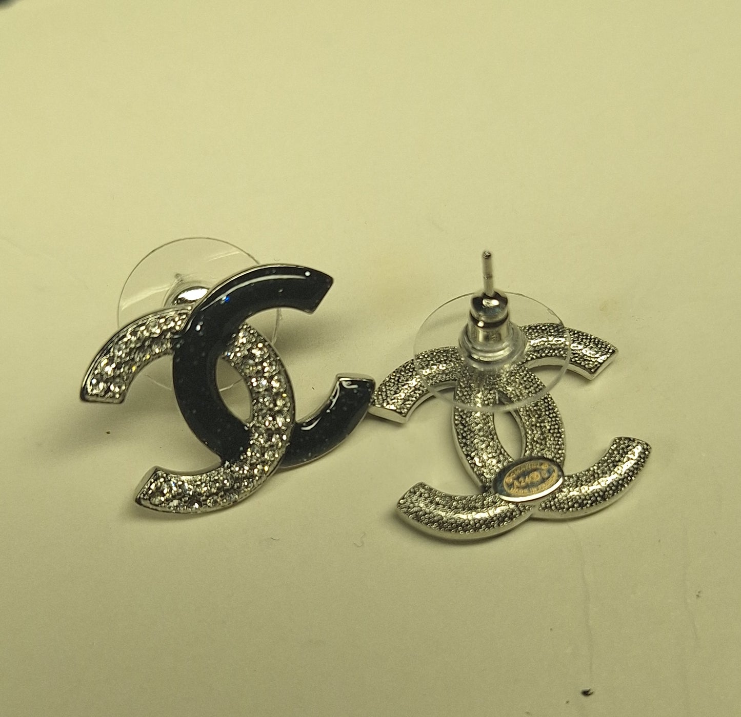 Earrings silver color and  black brocade enemal and zircon. Stamped. 16/20 mm