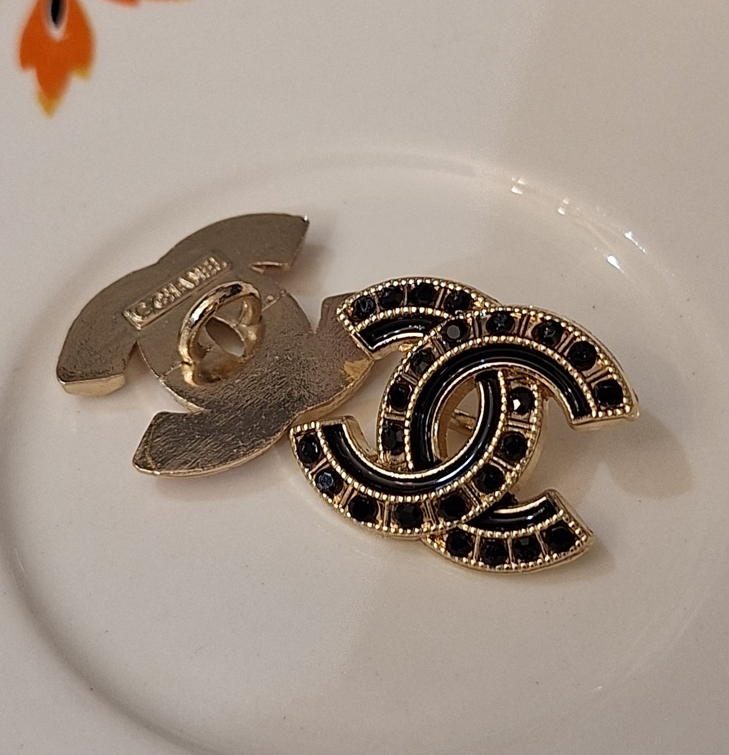 Buttons stamped,Gold, black zircon, black enemal. 18/22 mm