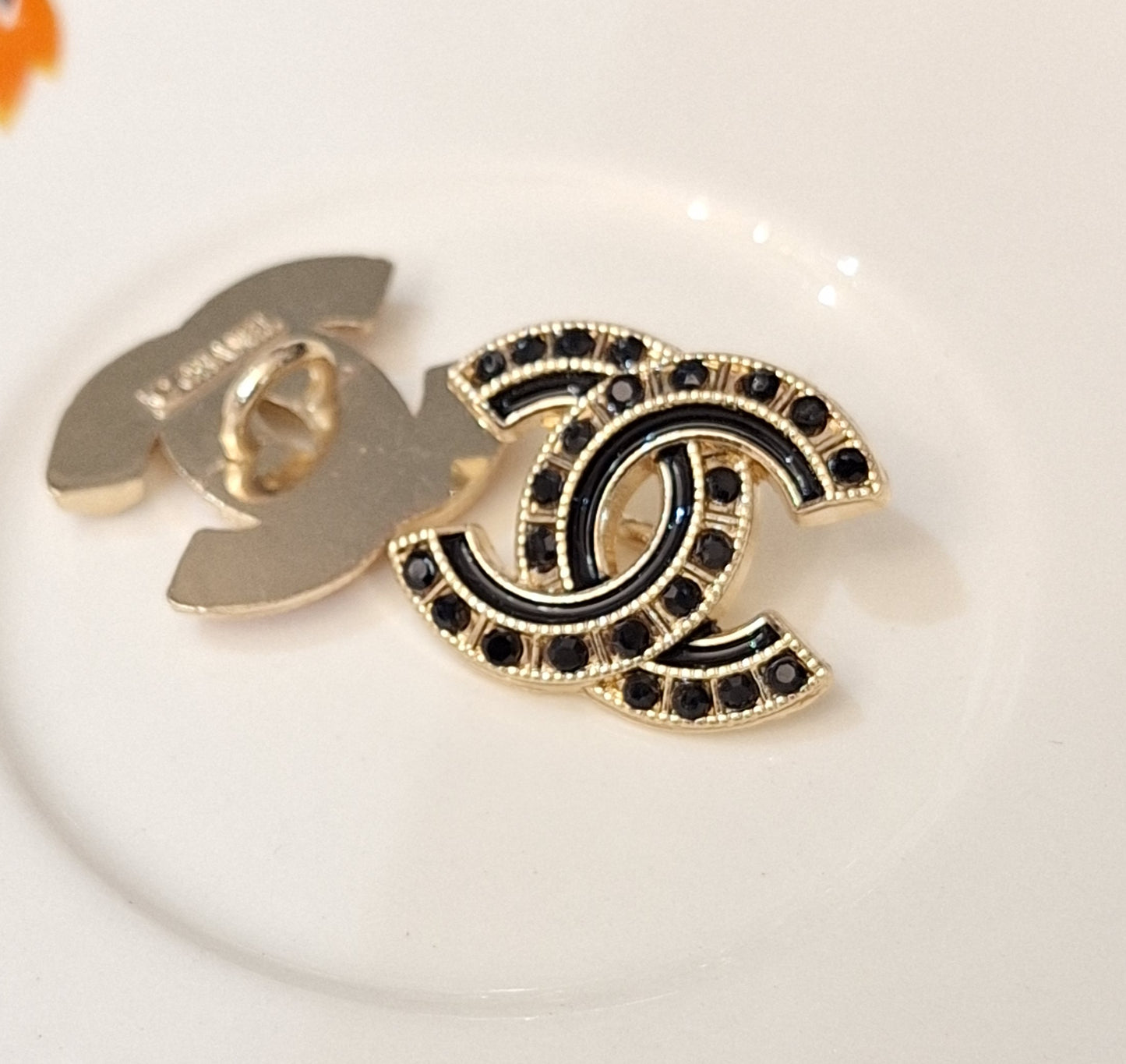 Buttons stamped,Gold, black zircon, black enemal. 18/22 mm