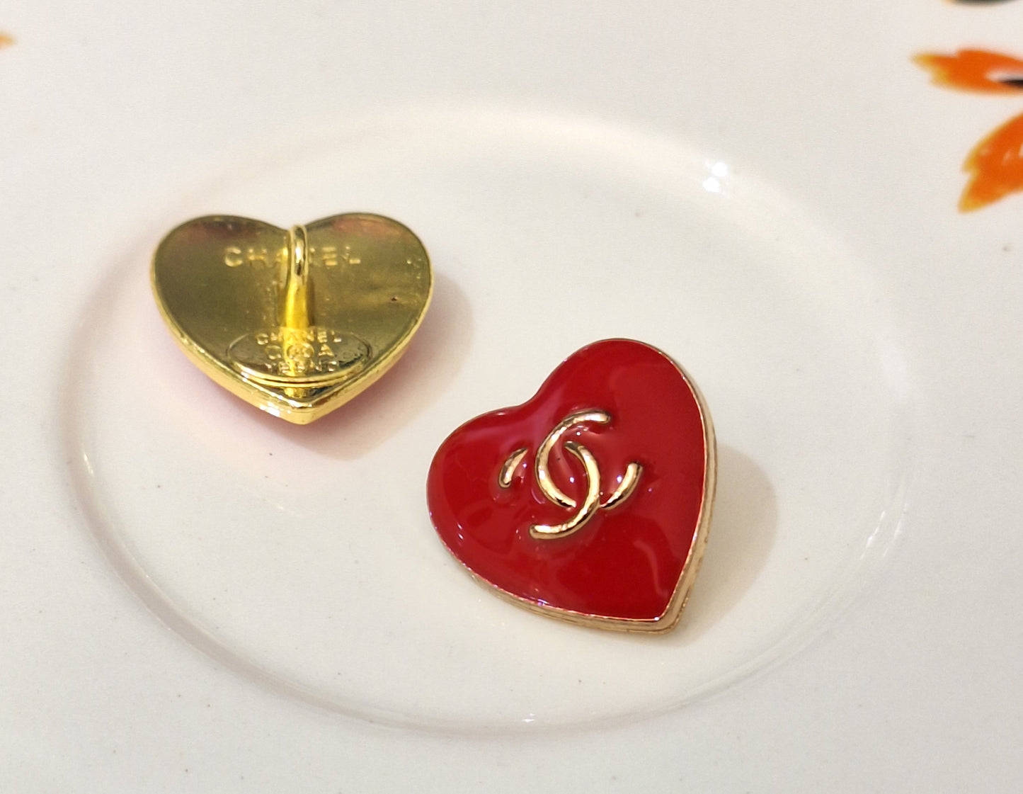 Buttons stamped. Gold & red. 16 mm