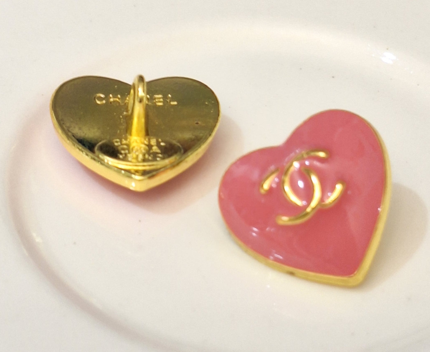 Buttons stamped. Gold & pink. 16 mm