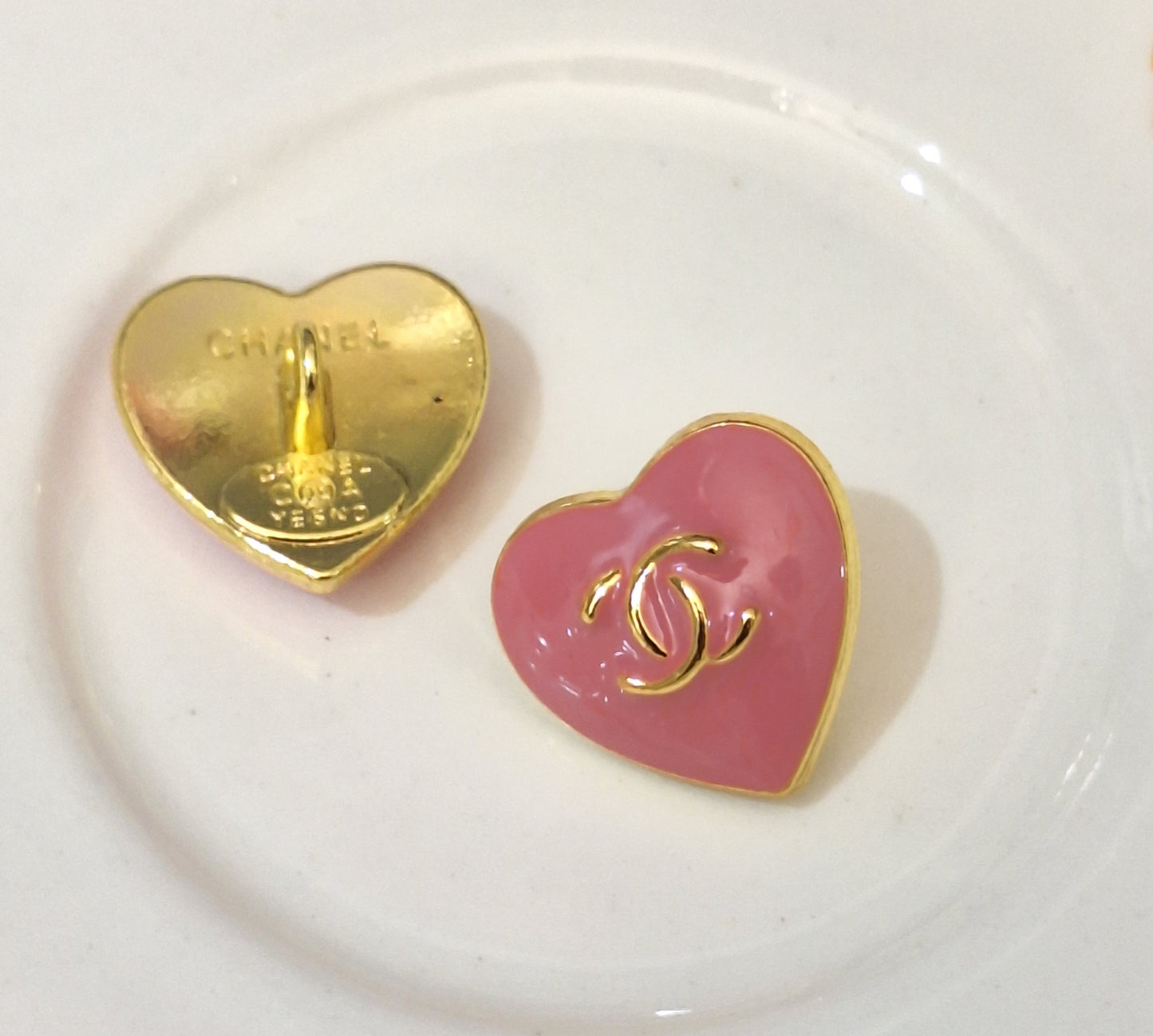 Buttons stamped. Gold & pink. 16 mm