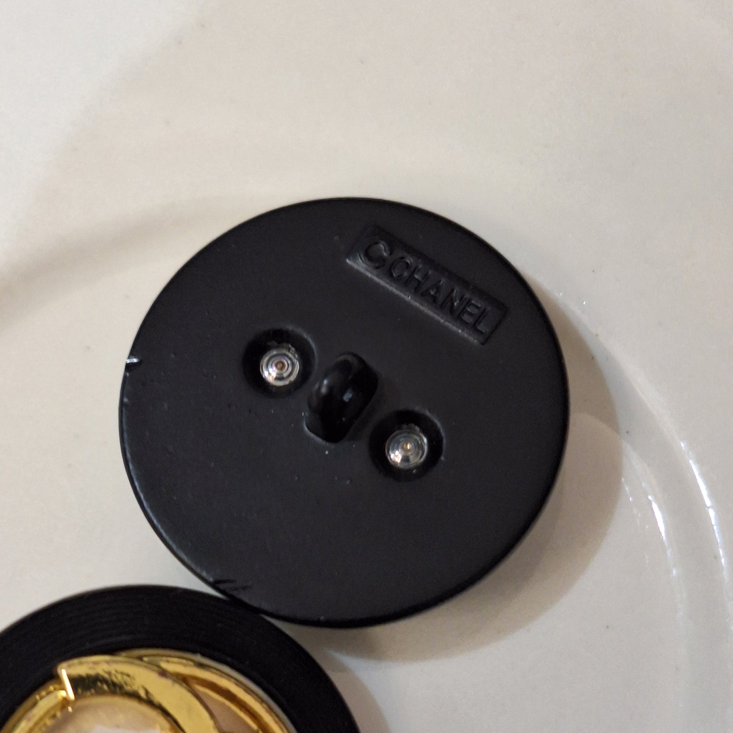 Buttons stamped. Black, white, Gold. 24 mm