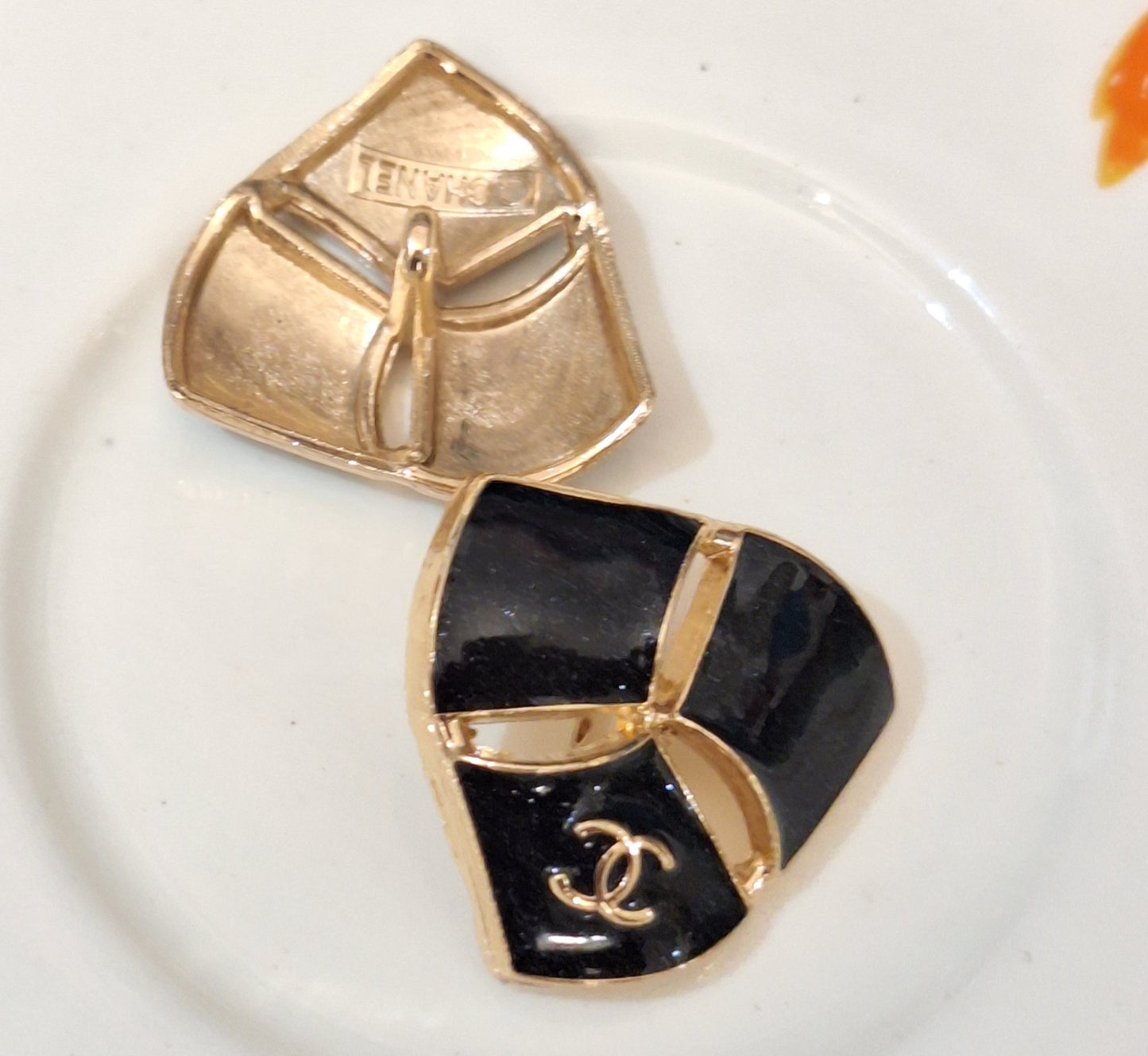 Buttons stamped black & gold.  22 mm