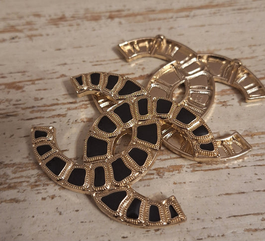 Tab - buttons, Gold & black 36/50 mm. 4 holes