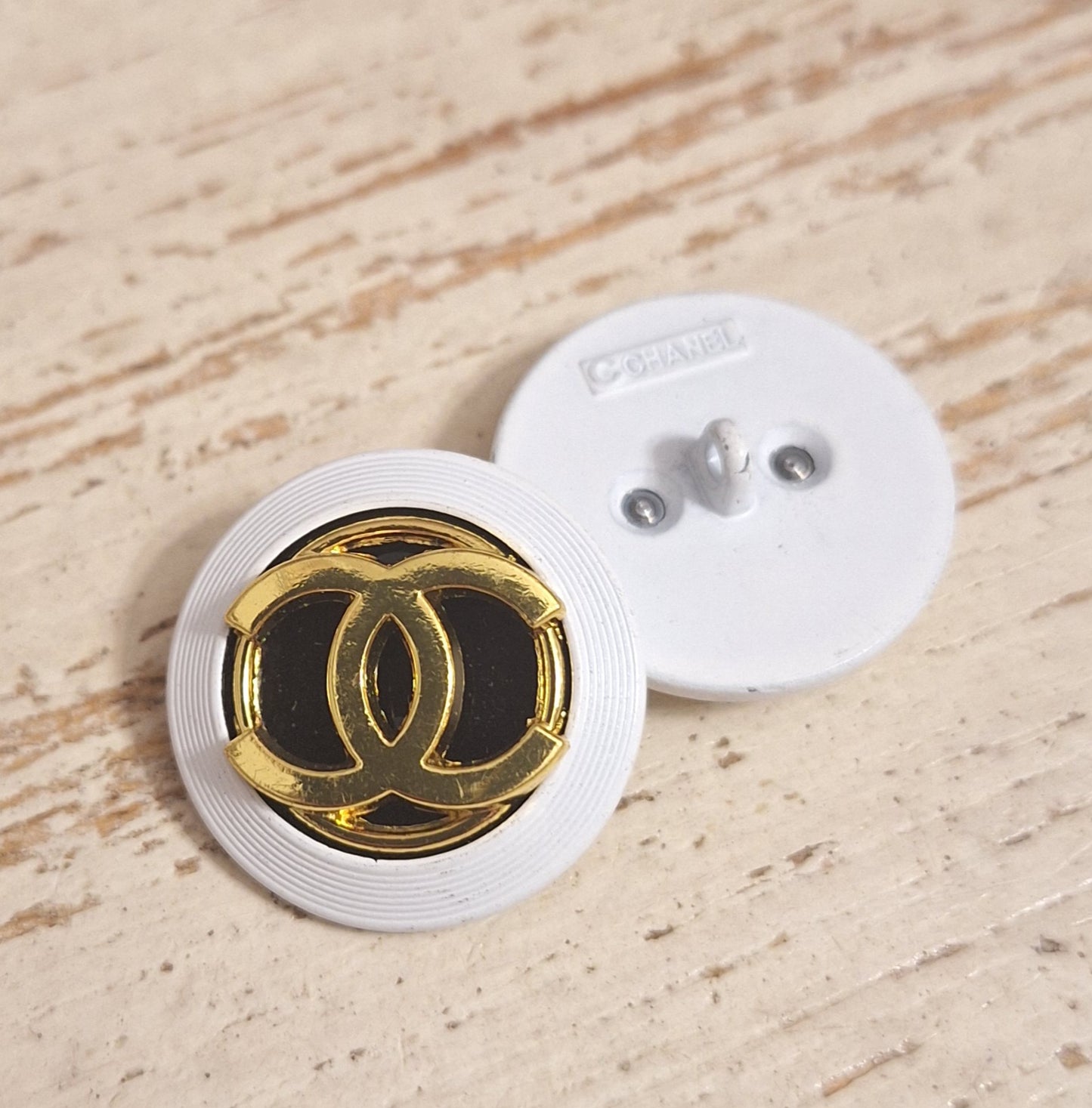 Buttons stamped, white, Gold & black. 24 mm