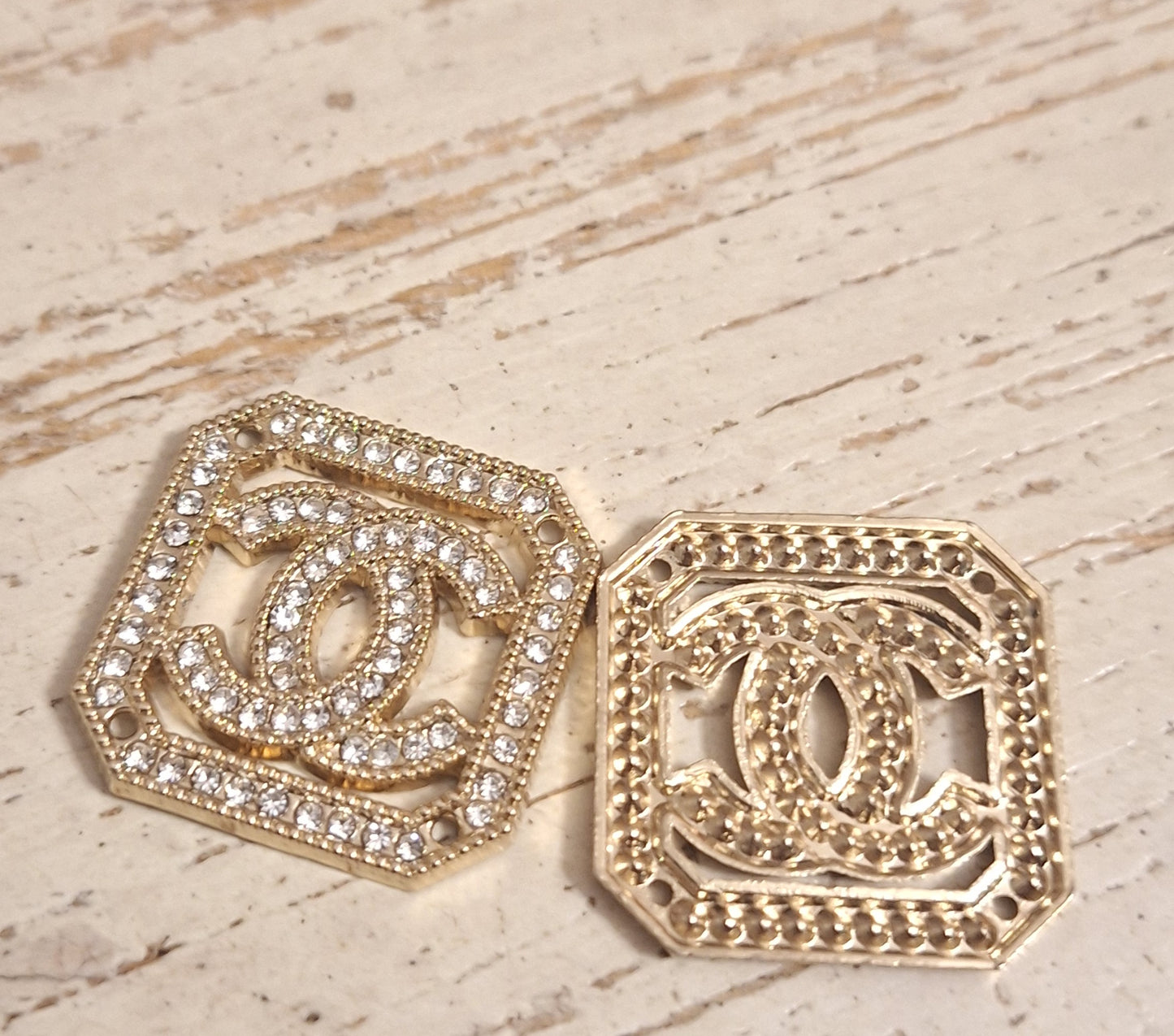 Tab, buttons - gold and zircon. 25 mm