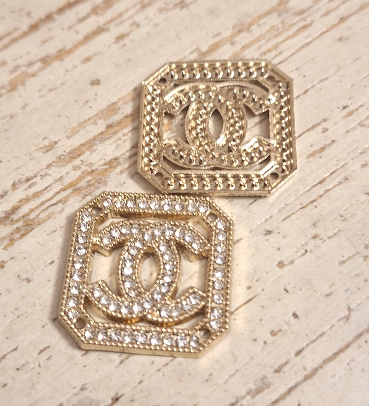 Tab, buttons - gold and zircon. 25 mm