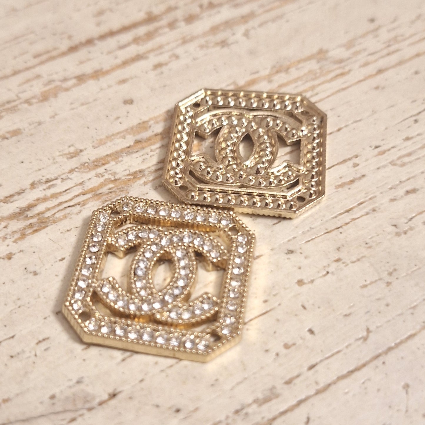 Tab, buttons - gold and zircon. 25 mm