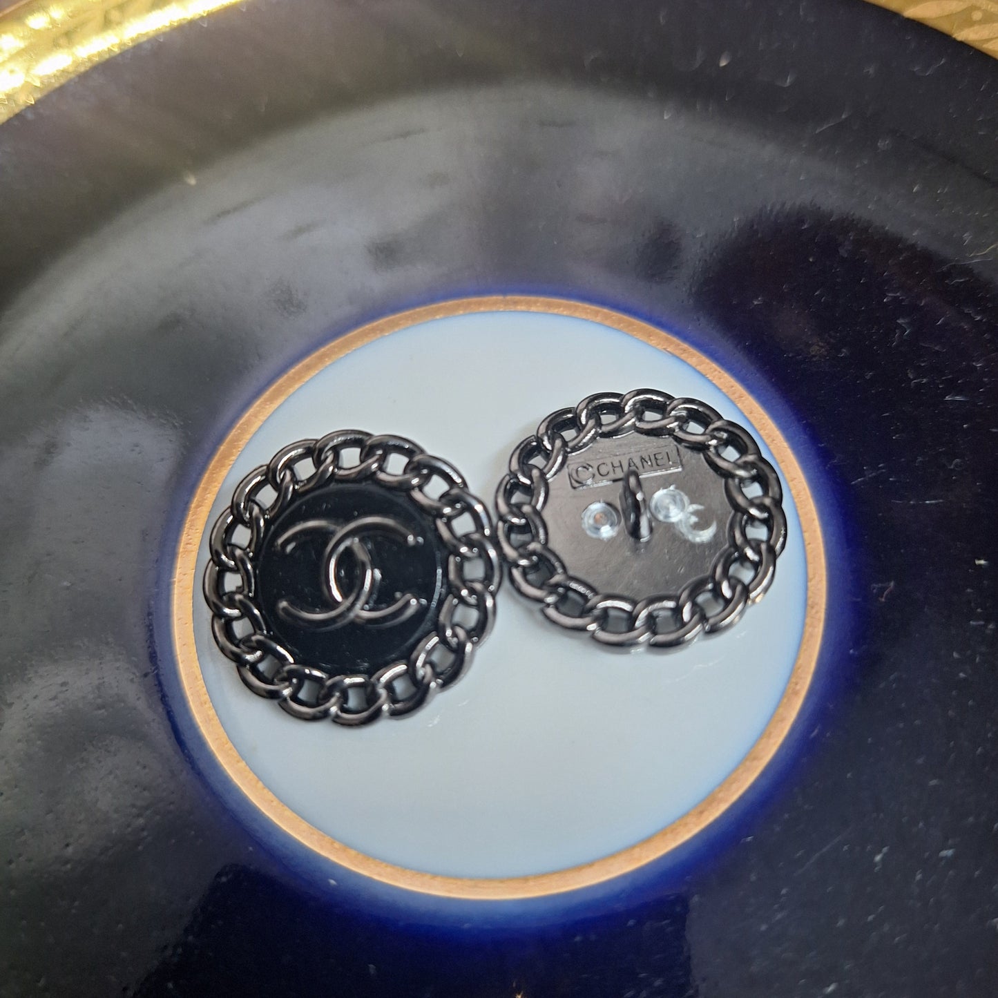 Buttons stamped black color. 23 mm