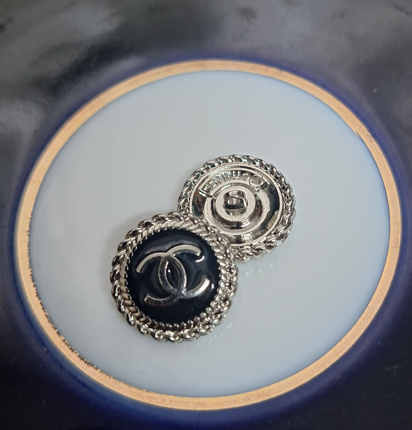 Buttons stamped. Silver & black enemal. 16 mm