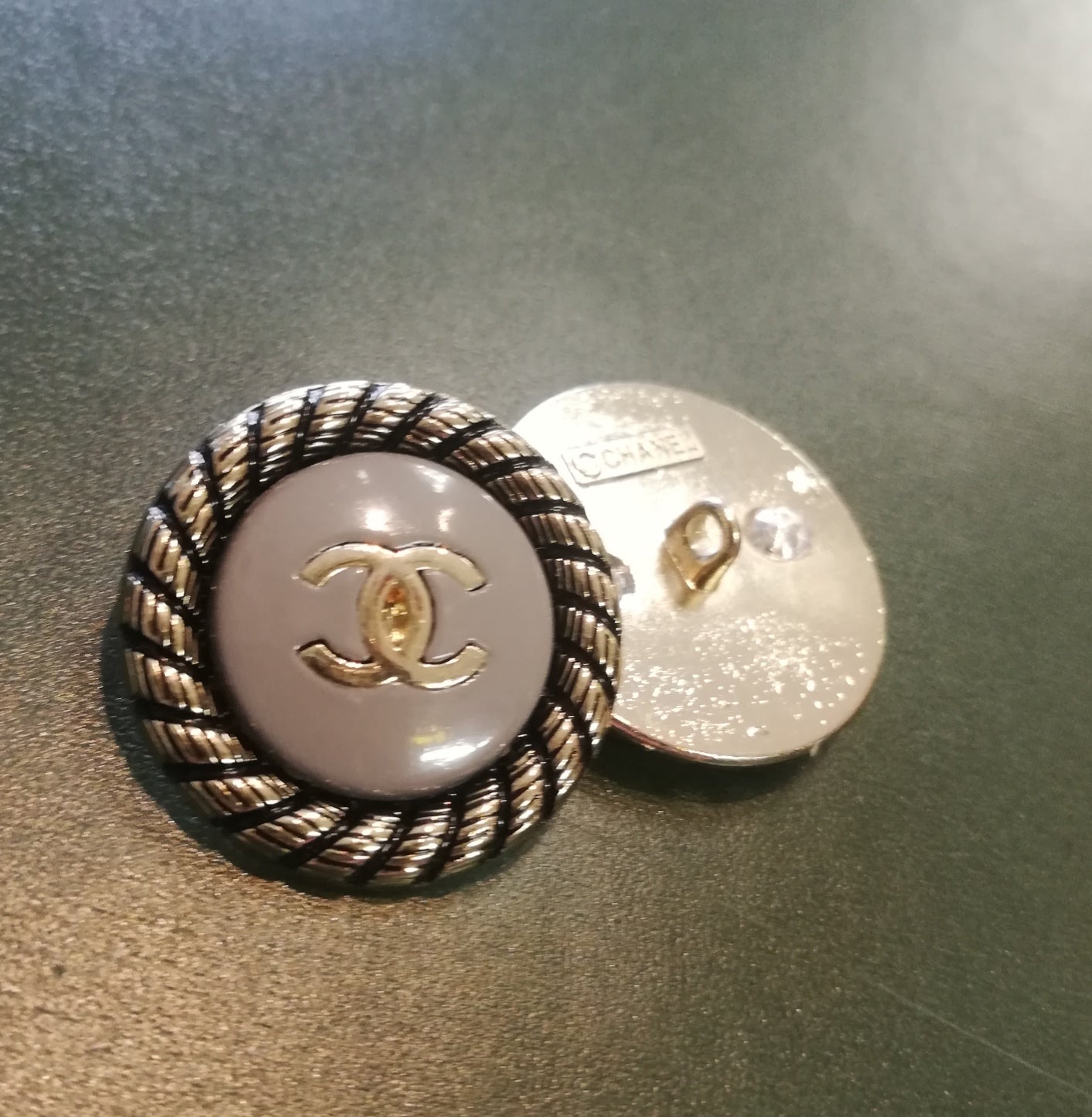 Buttons 24 mm. Gold, gray