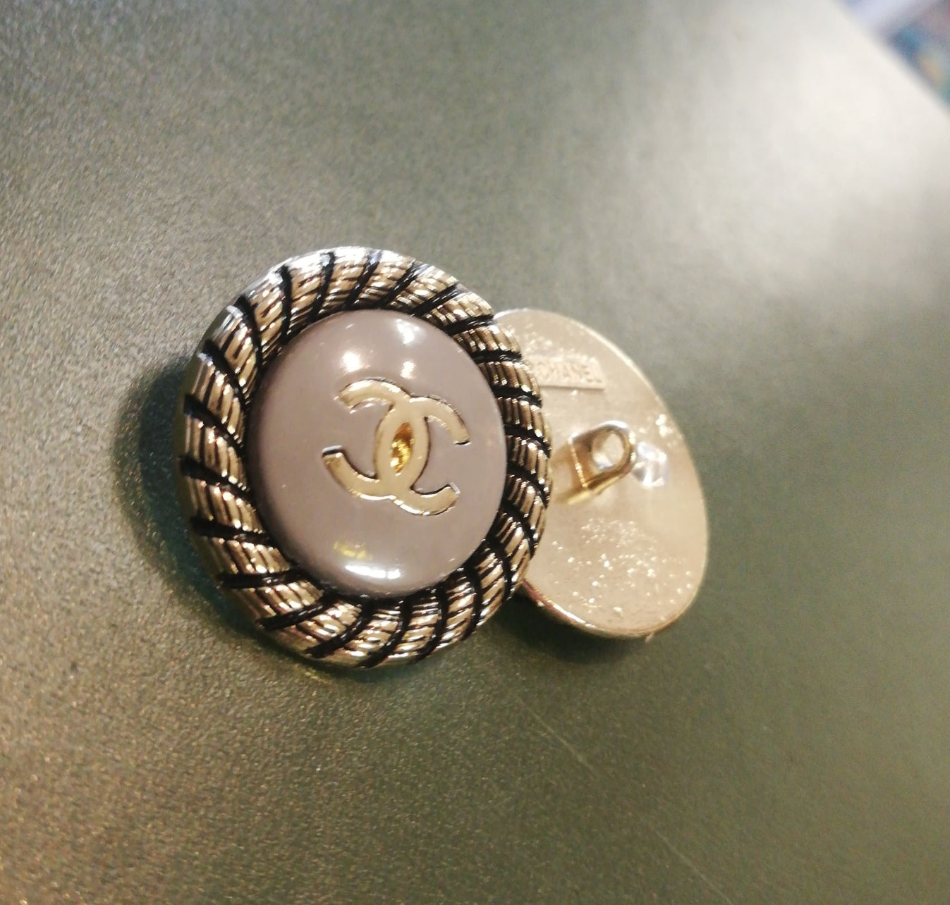 Buttons 24 mm. Gold, gray