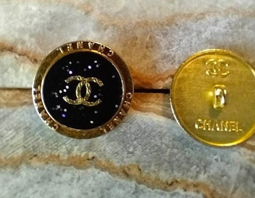 1 buttons gold & black glitter 23 mm